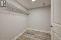 Walk in closet featuring light hardwood / wood-style flooring - 