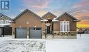 View of property featuring a garage - 705 Hollinger Drive S, Listowel, ON  - Outdoor With Facade 