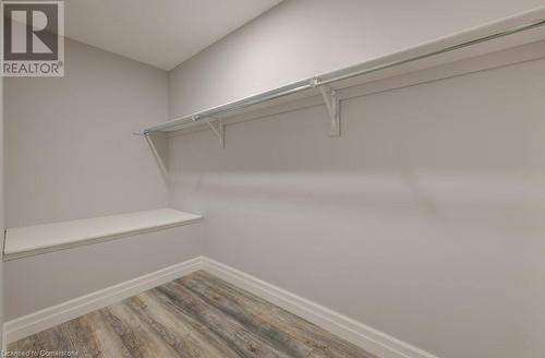 Walk in closet with wood-type flooring - 705 Hollinger Drive S, Listowel, ON - Indoor With Storage