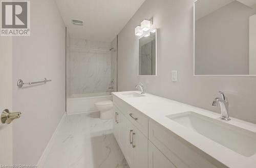 Full bathroom featuring tiled shower / bath combo, toilet, and vanity - 705 Hollinger Drive S, Listowel, ON - Indoor Photo Showing Bathroom