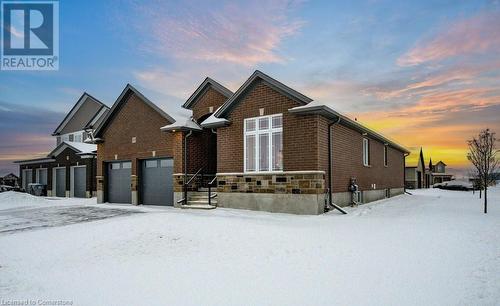 View of front of house with a garage - 705 Hollinger Drive S, Listowel, ON - Outdoor