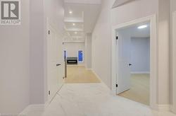 Hallway with beamed ceiling, crown molding, and coffered ceiling - 