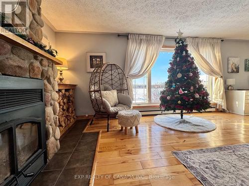 434 Carrigan Road, Timmins (Tm - Outside East), ON - Indoor Photo Showing Living Room With Fireplace