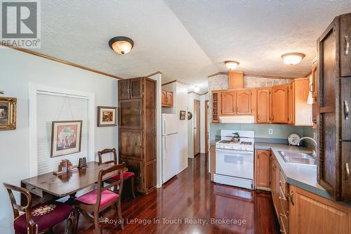 30 - 10 Winfield Drive, Tay (Victoria Harbour), ON - Indoor Photo Showing Kitchen With Double Sink