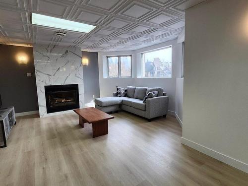 Family room - 3232 Ch. St-Charles, Terrebonne (Lachenaie), QC - Indoor Photo Showing Living Room With Fireplace