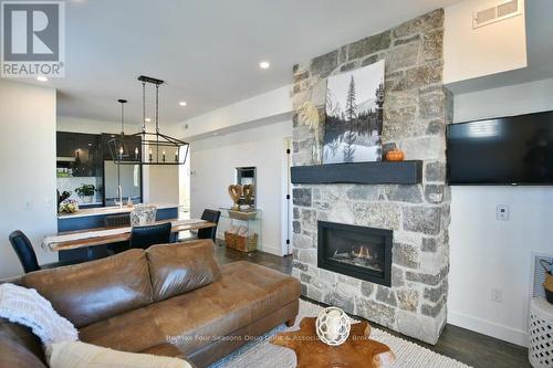 207 - 12 Beausoleil Lane, Blue Mountains (Blue Mountain Resort Area), ON - Indoor Photo Showing Living Room With Fireplace