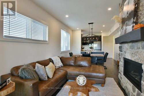 207 - 12 Beausoleil Lane, Blue Mountains (Blue Mountain Resort Area), ON - Indoor Photo Showing Living Room With Fireplace