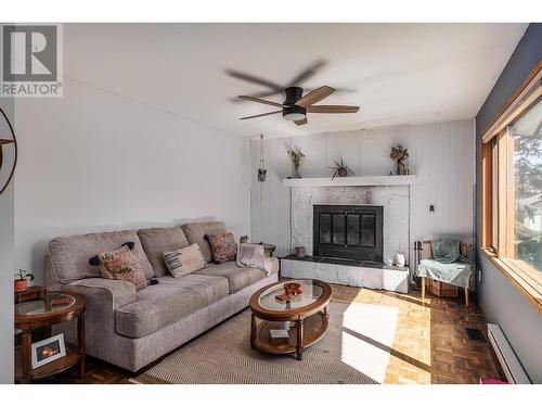 587 Mountain Drive, Vernon, BC - Indoor Photo Showing Living Room With Fireplace