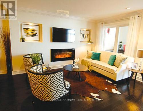 C56 - 350 Fisher Mills Road, Cambridge, ON - Indoor Photo Showing Living Room With Fireplace