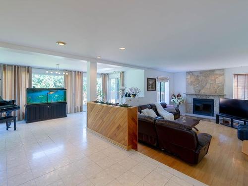 Salle familiale - 1075 Rue Renoir, Brossard, QC - Indoor Photo Showing Living Room With Fireplace