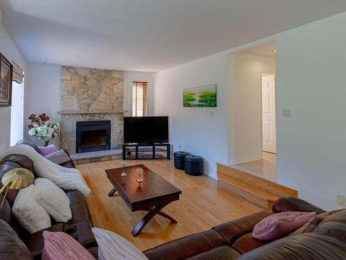 Salle familiale - 1075 Rue Renoir, Brossard, QC - Indoor Photo Showing Living Room With Fireplace