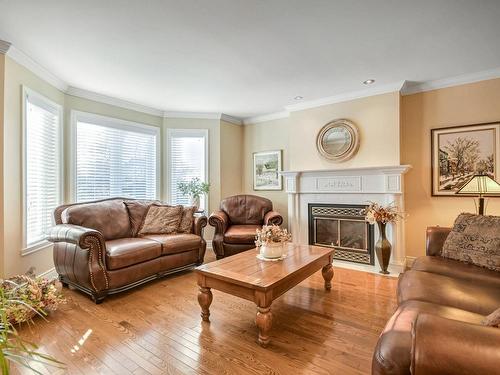 Salon - 25 Rue Du Boisé, Lachute, QC - Indoor Photo Showing Living Room With Fireplace