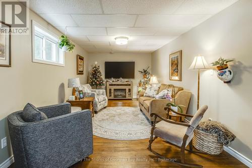 60 Concession 4 E, Tiny, ON - Indoor Photo Showing Living Room With Fireplace