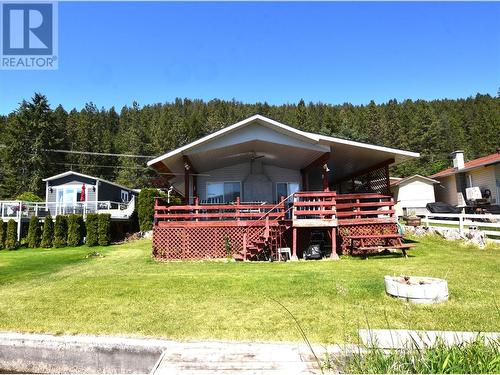 Covered front deck so you can enjoy the lakeview everyday all day - 10983 Westside Road, Vernon, BC - Outdoor With Deck Patio Veranda