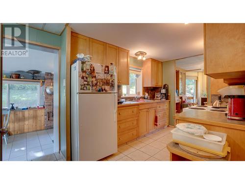 Kitchen with dishwasher and custom cabinets - 2868 Coates Road, Sorrento, BC 