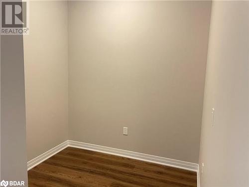 Empty room featuring hardwood / wood-style flooring - 490 Gordon Krantz Avenue Unit# 602, Milton, ON - Indoor Photo Showing Other Room