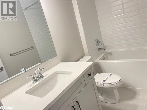 Full bathroom featuring tile patterned floors, vanity, shower / bathtub combination, and toilet - 490 Gordon Krantz Avenue Unit# 602, Milton, ON - Indoor Photo Showing Bathroom