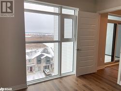 Doorway to outside featuring hardwood / wood-style flooring - 