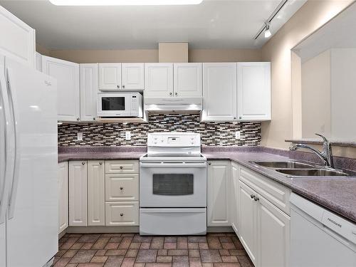 204-2475 Bevan Ave, Sidney, BC - Indoor Photo Showing Kitchen With Double Sink