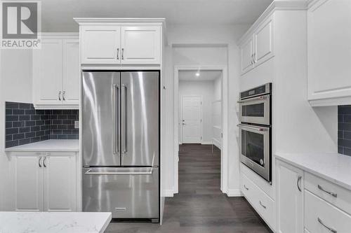 114 Lucas Terrace Nw, Calgary, AB - Indoor Photo Showing Kitchen With Stainless Steel Kitchen