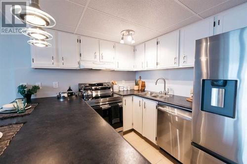 New stainless steel appliances - 912, 4902 37 Street, Red Deer, AB - Indoor Photo Showing Kitchen With Stainless Steel Kitchen With Double Sink