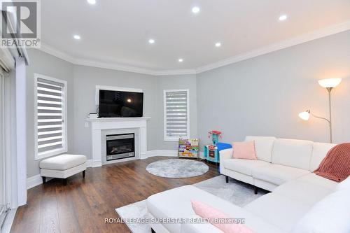 Upper - 12 El Camino Way, Brampton, ON - Indoor Photo Showing Living Room With Fireplace