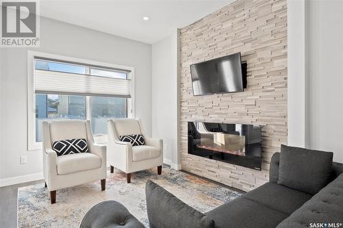 352 Brighton Gate, Saskatoon, SK - Indoor Photo Showing Living Room With Fireplace