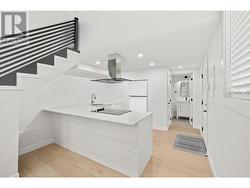 Stair railing, dishwasher, range hood and fridge are photoshopped in. Waiting on appliance to arrive. - 