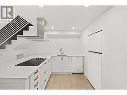 Stair railing, dishwasher, range hood and fridge are photoshopped in. Waiting on appliance to arrive. - 