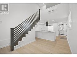 Stair railing, dishwasher, range hood and fridge are photoshopped in. Waiting on appliance to arrive. - 