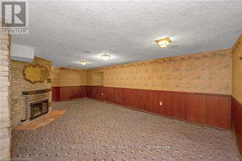 12 Robertson Place, St. Catharines, ON - Indoor Photo Showing Other Room With Fireplace