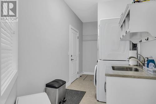 Laundry Room entry to Garage and/or main House Hallway - 3400 Kingfisher Road, West Kelowna, BC - Indoor Photo Showing Laundry Room