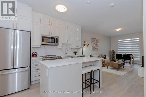 203 - 460 Gordon Krantz Avenue, Milton, ON - Indoor Photo Showing Kitchen With Stainless Steel Kitchen