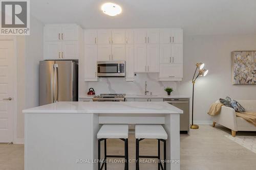 203 - 460 Gordon Krantz Avenue, Milton, ON - Indoor Photo Showing Kitchen With Stainless Steel Kitchen