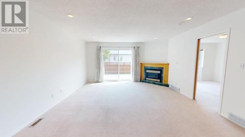 10108 108 Avenue, Fort St. John, BC - Indoor Photo Showing Living Room With Fireplace