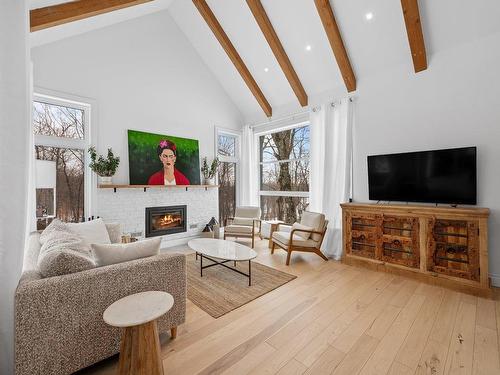 Living room - 1499 Rue Du Clos-Des-Artisans, Prévost, QC - Indoor Photo Showing Living Room With Fireplace