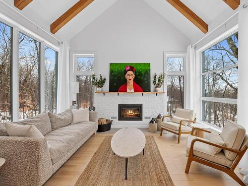 Living room - 1499 Rue Du Clos-Des-Artisans, Prévost, QC - Indoor Photo Showing Living Room With Fireplace