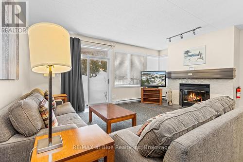 103 - 107 Ann Heggtveit Drive, Blue Mountains (Blue Mountain Resort Area), ON - Indoor Photo Showing Living Room With Fireplace