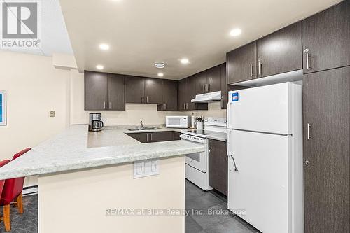 103 - 107 Ann Heggtveit Drive, Blue Mountains (Blue Mountain Resort Area), ON - Indoor Photo Showing Kitchen With Double Sink