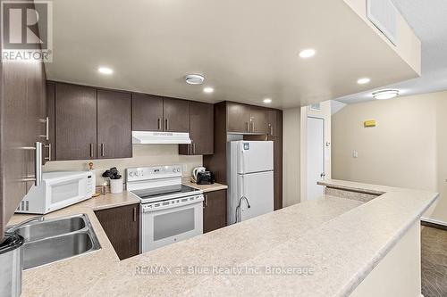 103 - 107 Ann Heggtveit Drive, Blue Mountains (Blue Mountain Resort Area), ON - Indoor Photo Showing Kitchen With Double Sink