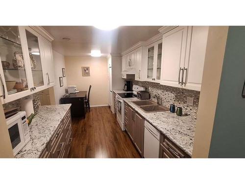 103-10461 Resthaven Dr, Sidney, BC - Indoor Photo Showing Kitchen With Double Sink