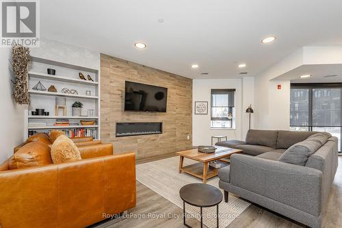 205 - 332 Gosling Gardens, Guelph (Guelph South), ON - Indoor Photo Showing Living Room With Fireplace