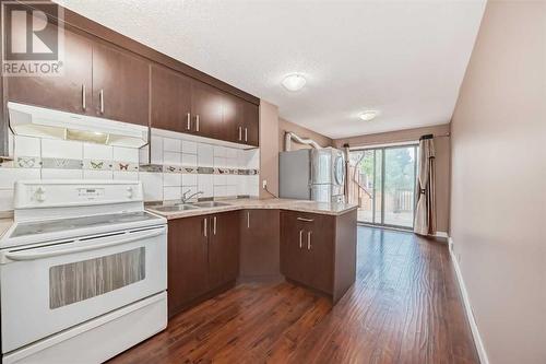 kitchen main - 112 Falwood Crescent Ne, Calgary, AB - Indoor Photo Showing Kitchen With Double Sink