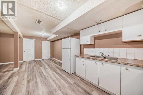 112 Falwood Crescent Ne, Calgary, AB - Indoor Photo Showing Kitchen With Double Sink