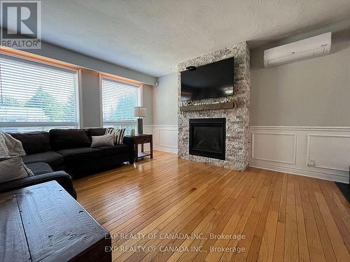 721 Churchill Street, Timmins, ON - Indoor Photo Showing Living Room With Fireplace