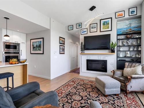 802-4009 Rainbow Hill Lane, Saanich, BC - Indoor Photo Showing Living Room With Fireplace