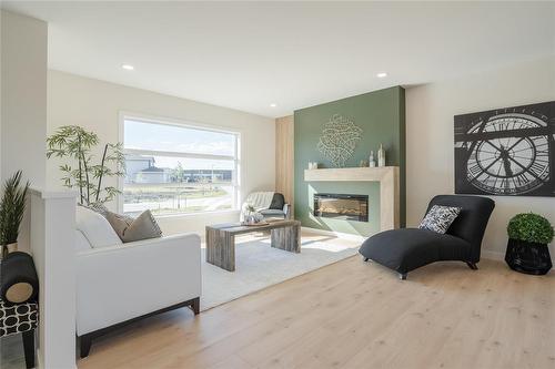 81 Wild Plum Lane, Steinbach, MB - Indoor Photo Showing Living Room With Fireplace