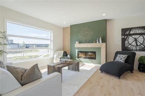 81 Wild Plum Lane, Steinbach, MB - Indoor Photo Showing Living Room With Fireplace