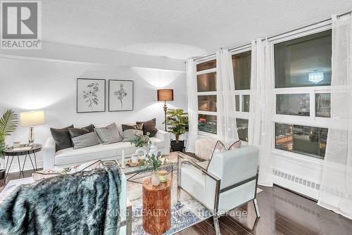 1412 - 3380 Eglinton Avenue E, Toronto, ON - Indoor Photo Showing Living Room