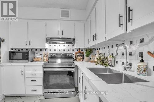 1412 - 3380 Eglinton Avenue E, Toronto, ON - Indoor Photo Showing Kitchen With Double Sink